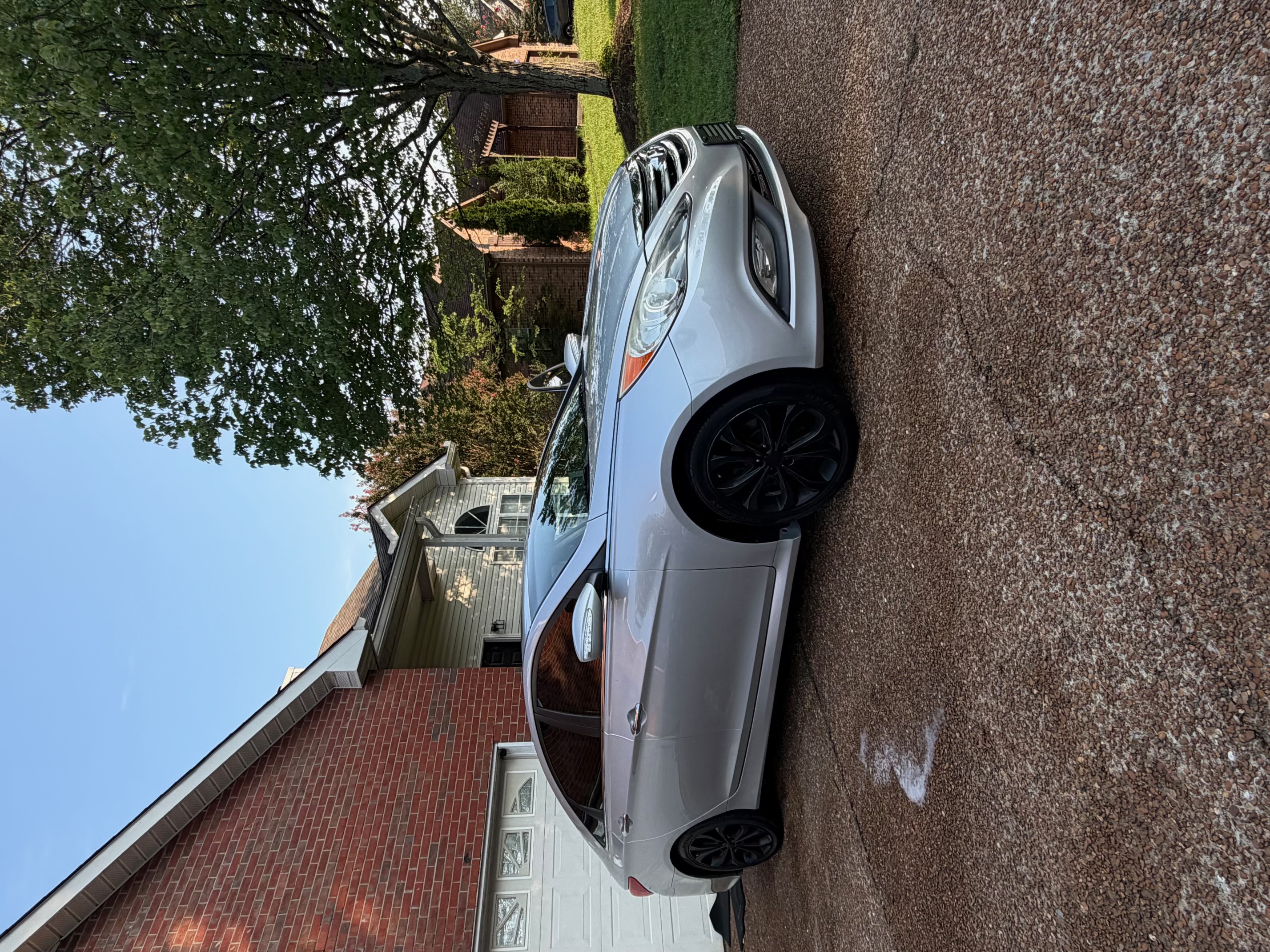 Silver sedan after wash high angle