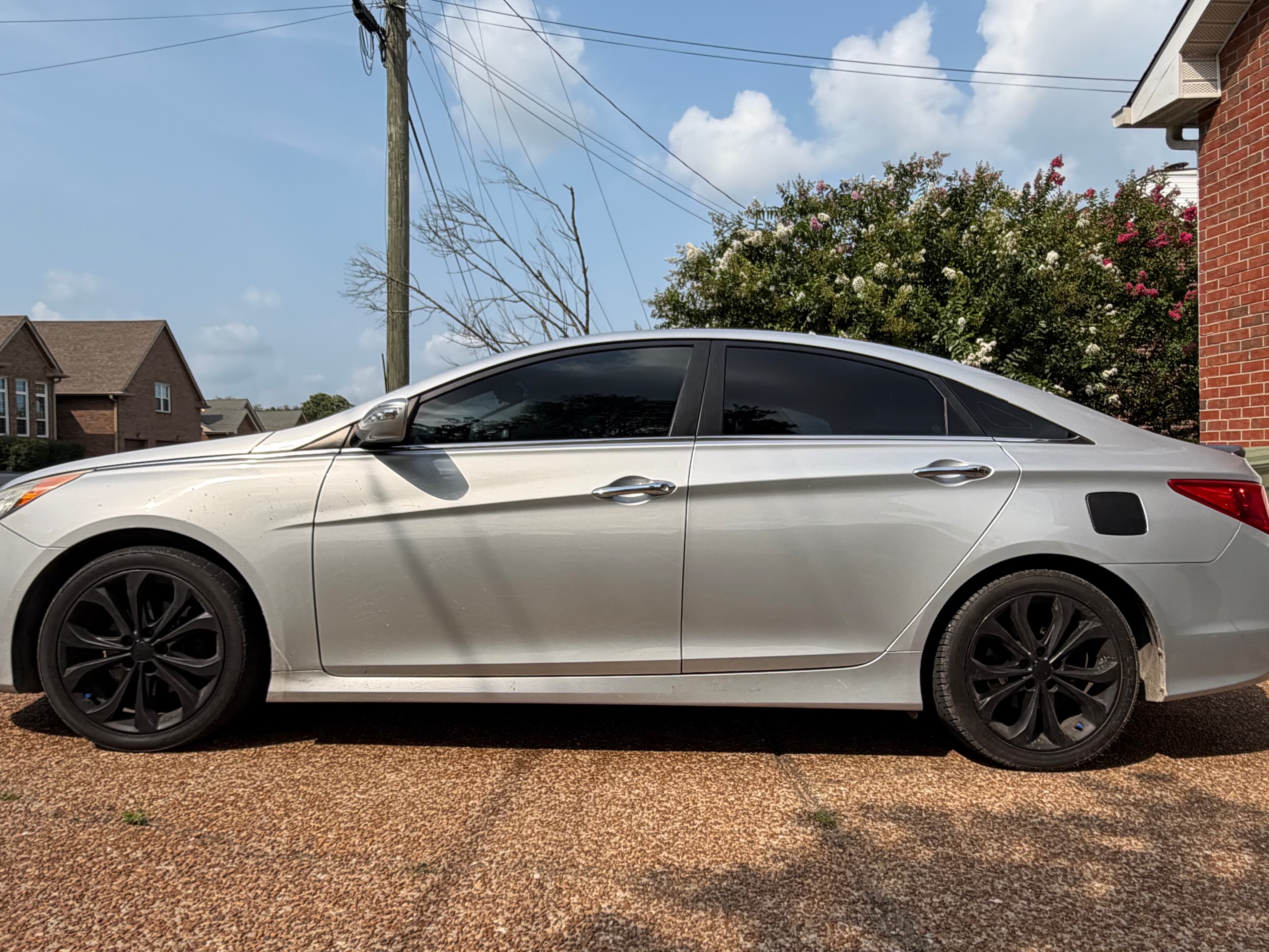 Before: silver Sonata with road film and dull paint.