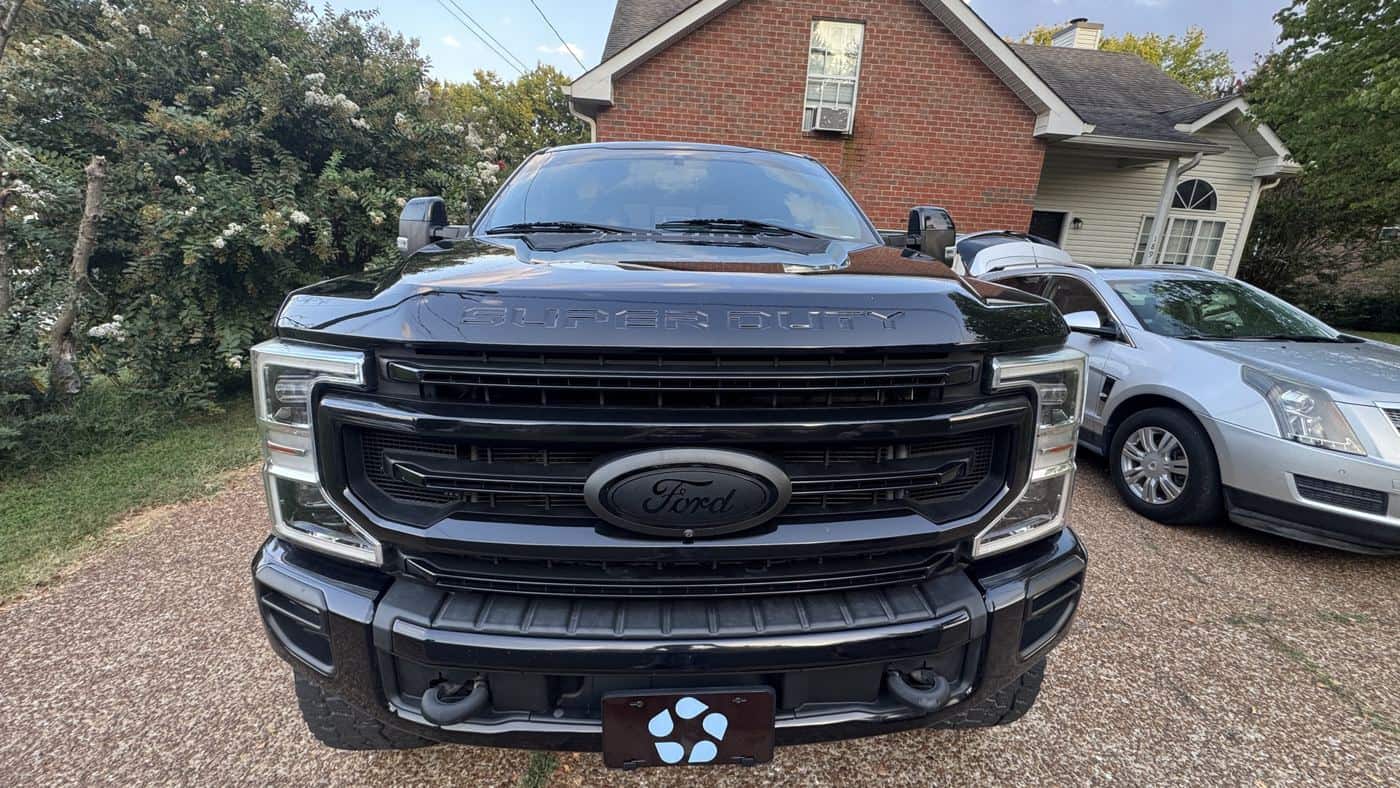 Front of a black Ford F-250 after a wash