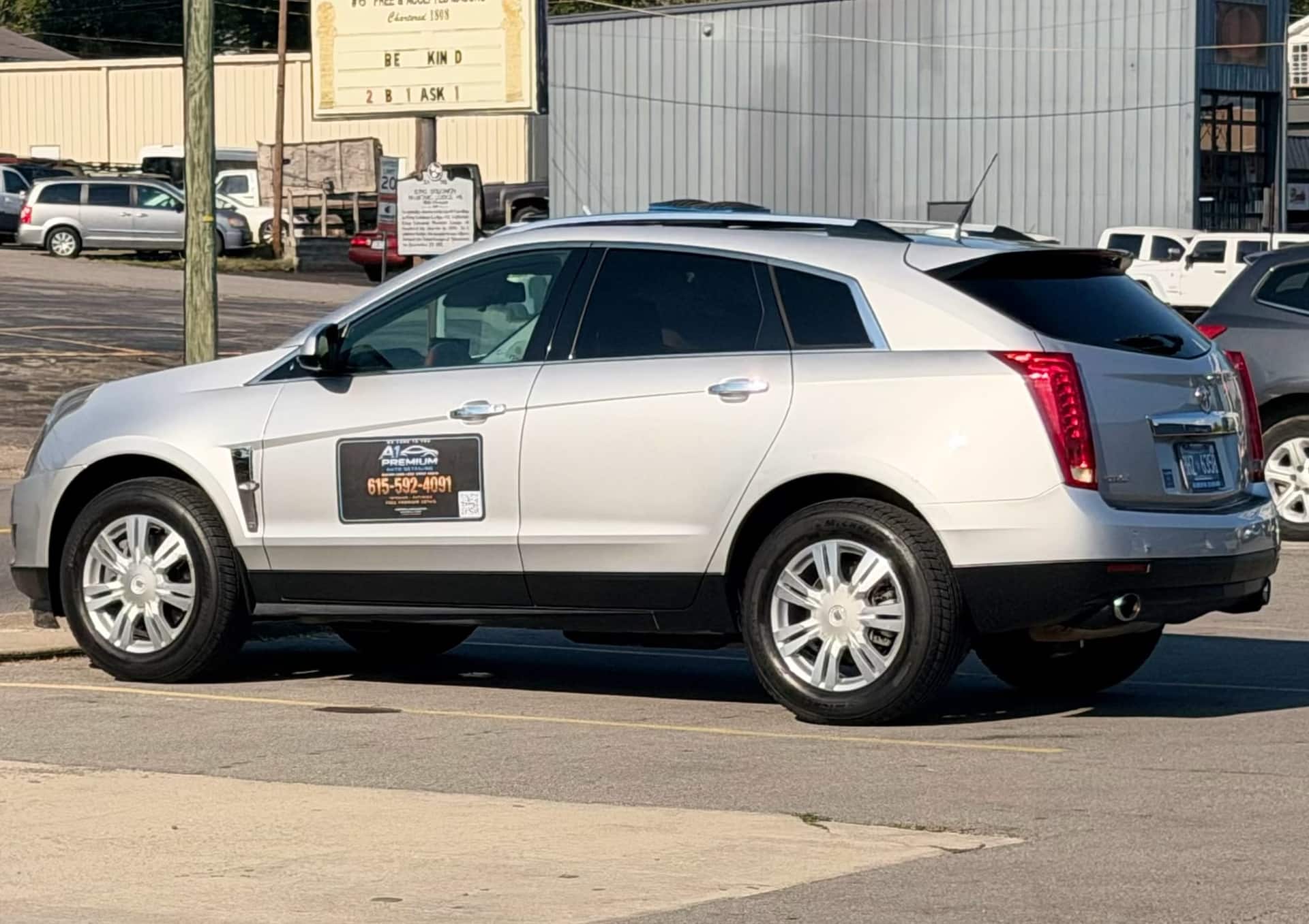 Silver Cadillac SRX with an A1 Premium door magnet