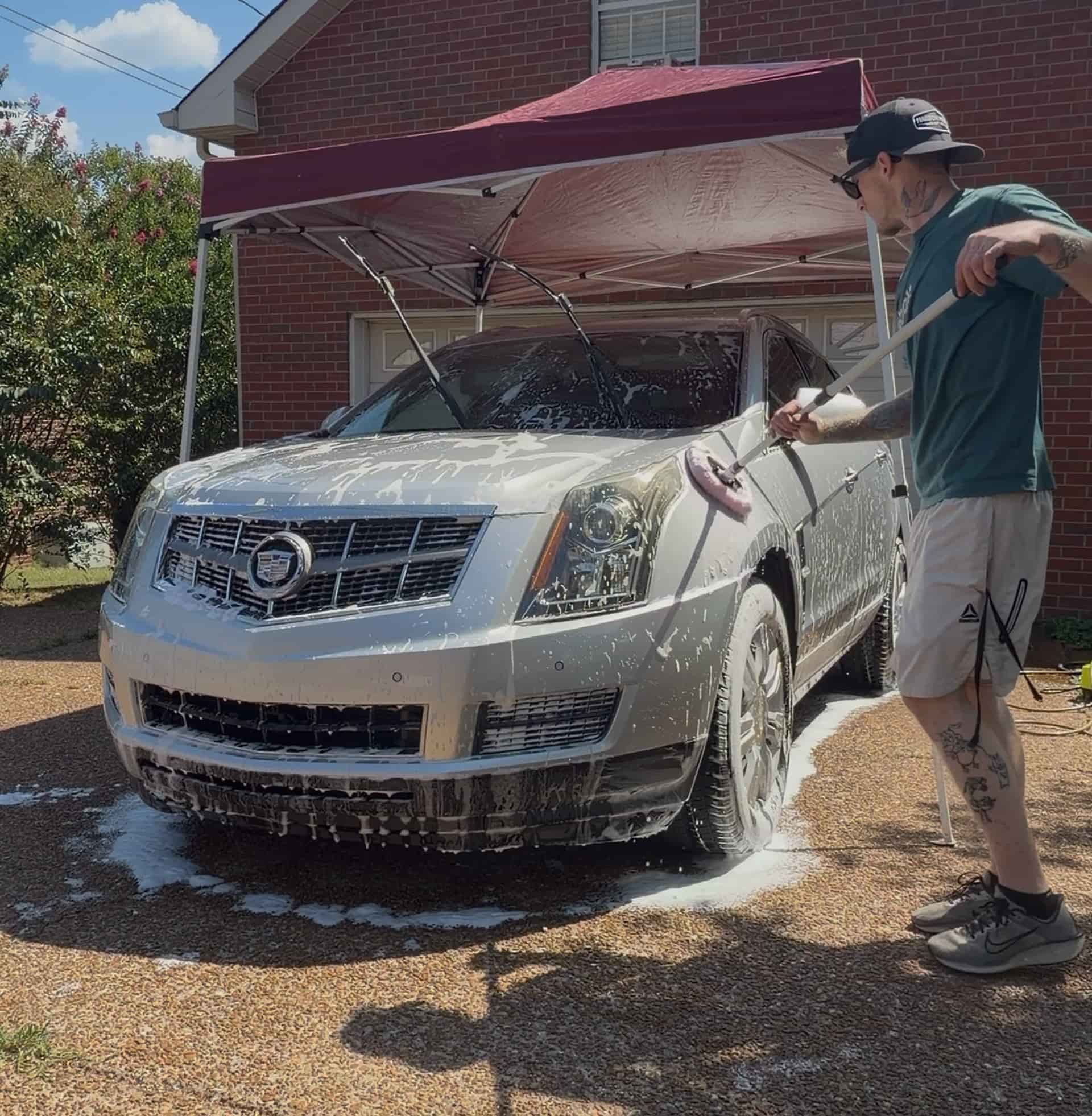 Jacob spraying foam on a Cadillac SRX