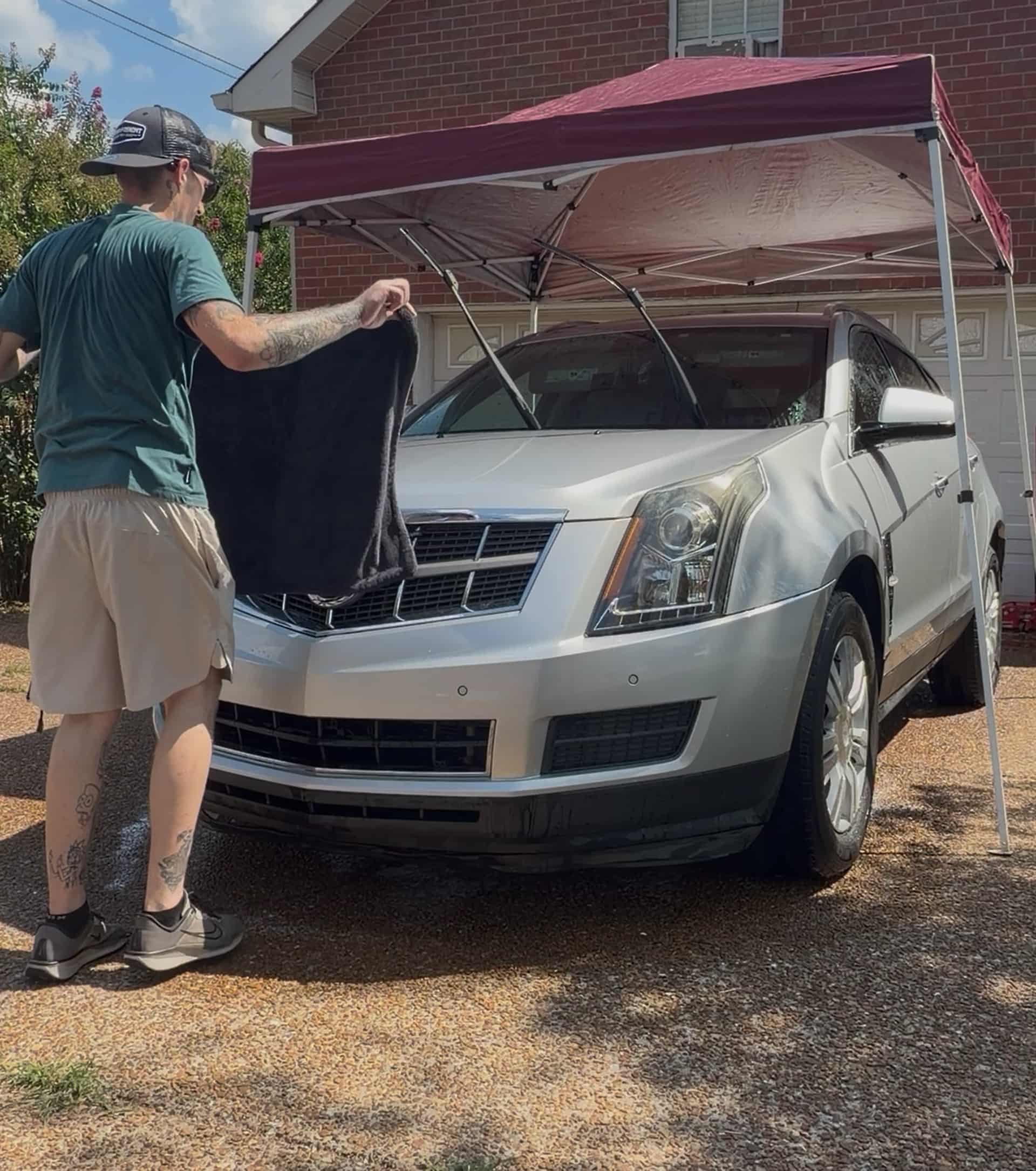 Jacob drying a Cadillac SRX with a towel