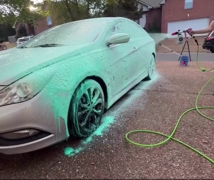 Teal foam sprayed over a silver Hyundai Sonata