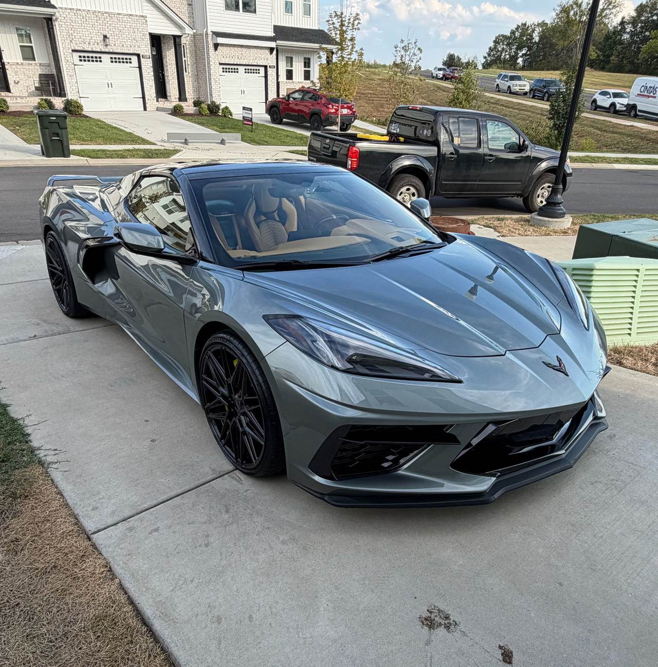 Gray Corvette on a driveway after a mobile detail