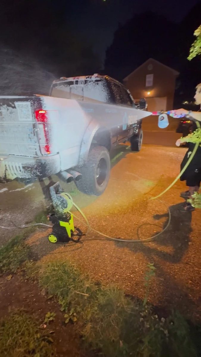 Night foam wash on a Super Duty truck at a customer driveway.