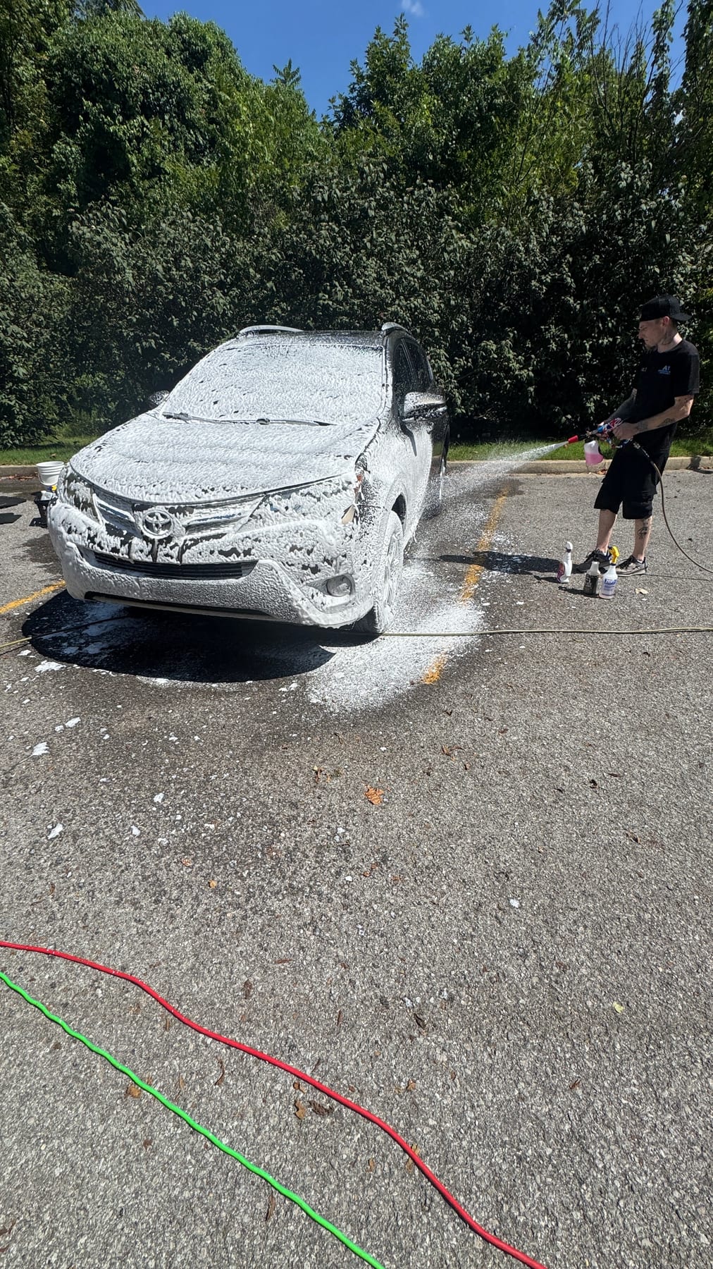 Applying snow foam with a foam cannon on a Toyota RAV4