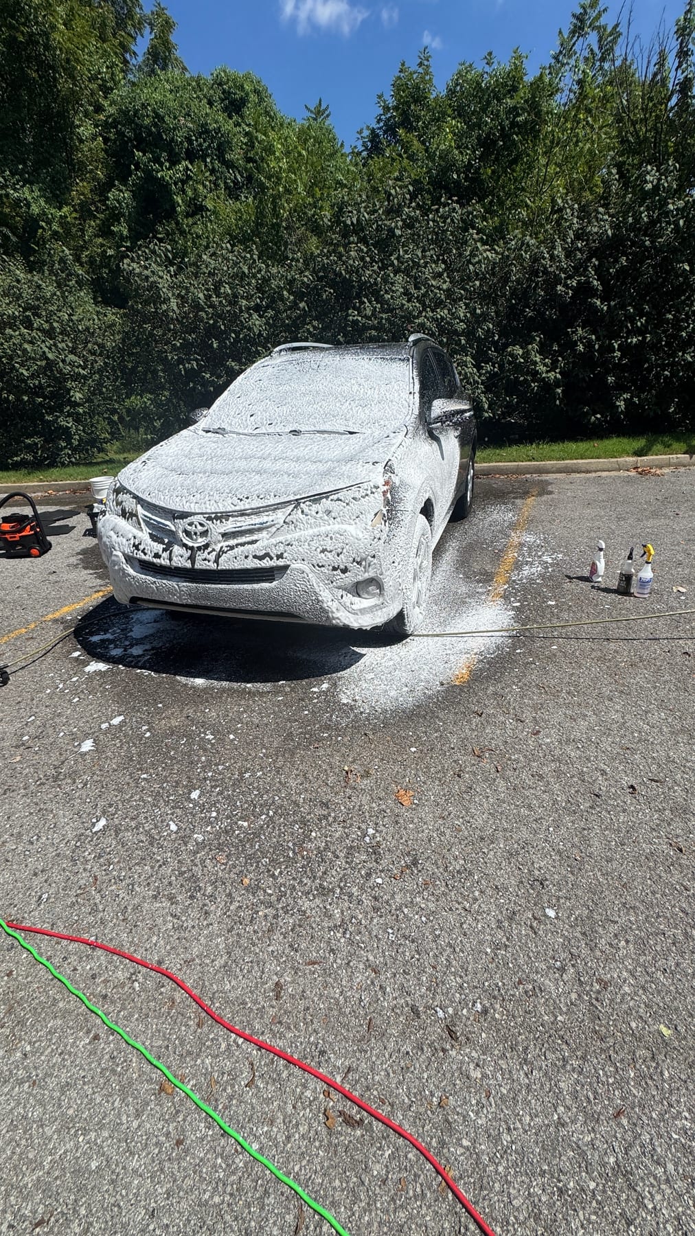 Toyota RAV4 covered in A1 snow foam before rinse.