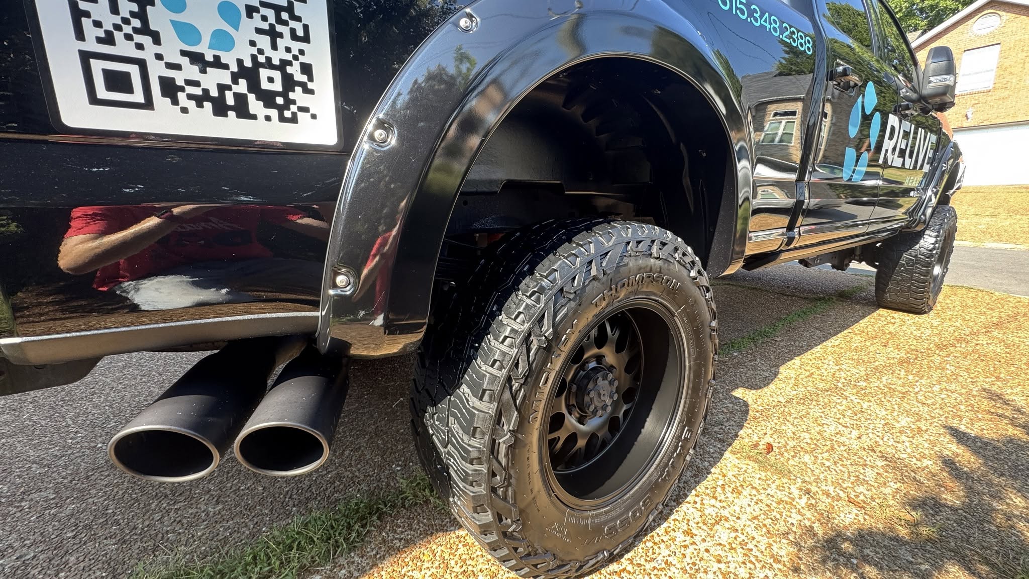 Relive Health F-250 Super Duty after an A1 Premium driveway detail.