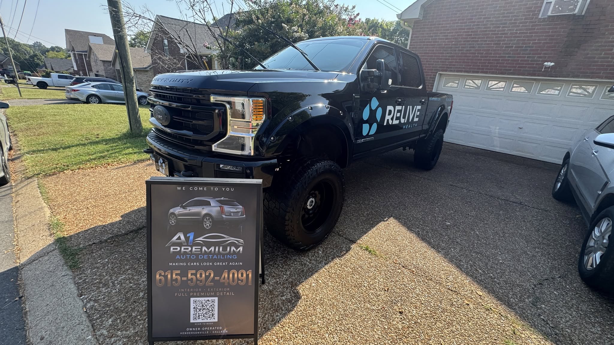 A1 Premium sign and Relive Health F-250 after a Full Premium Detail.