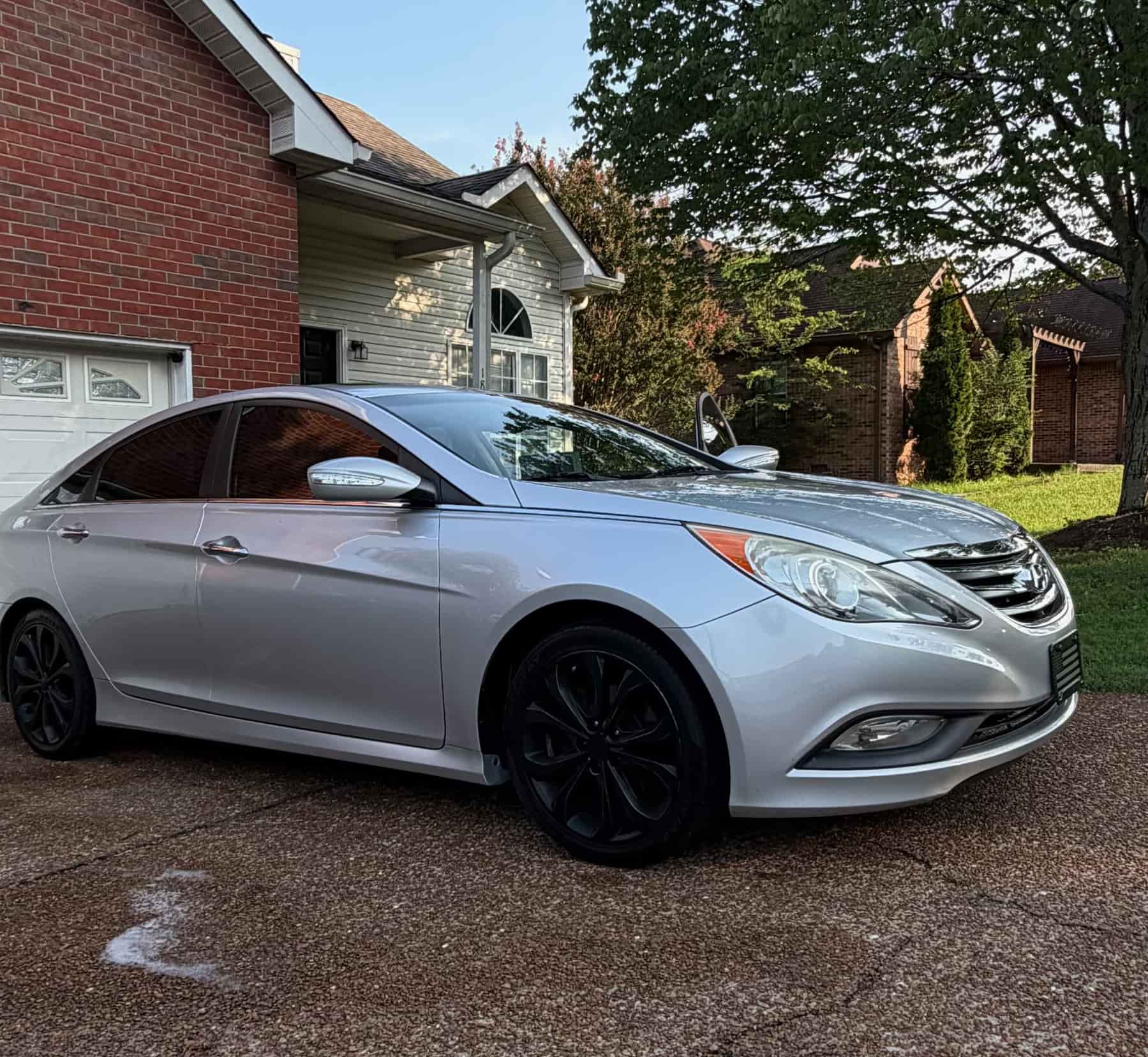 Silver Hyundai Sonata from the front after a wash