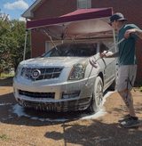 Jacob rinsing a Cadillac SRX