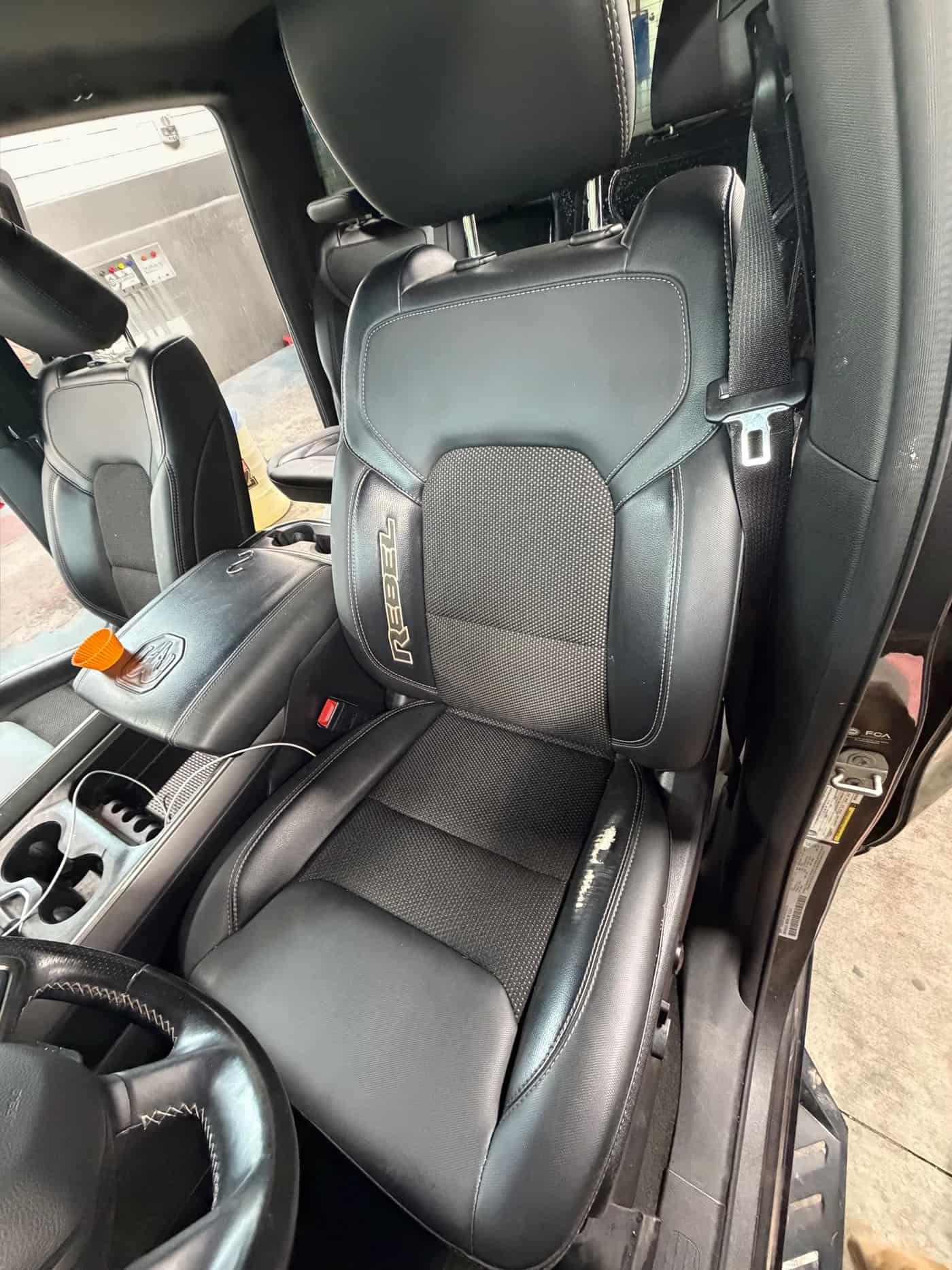 Black leather front seat after conditioning