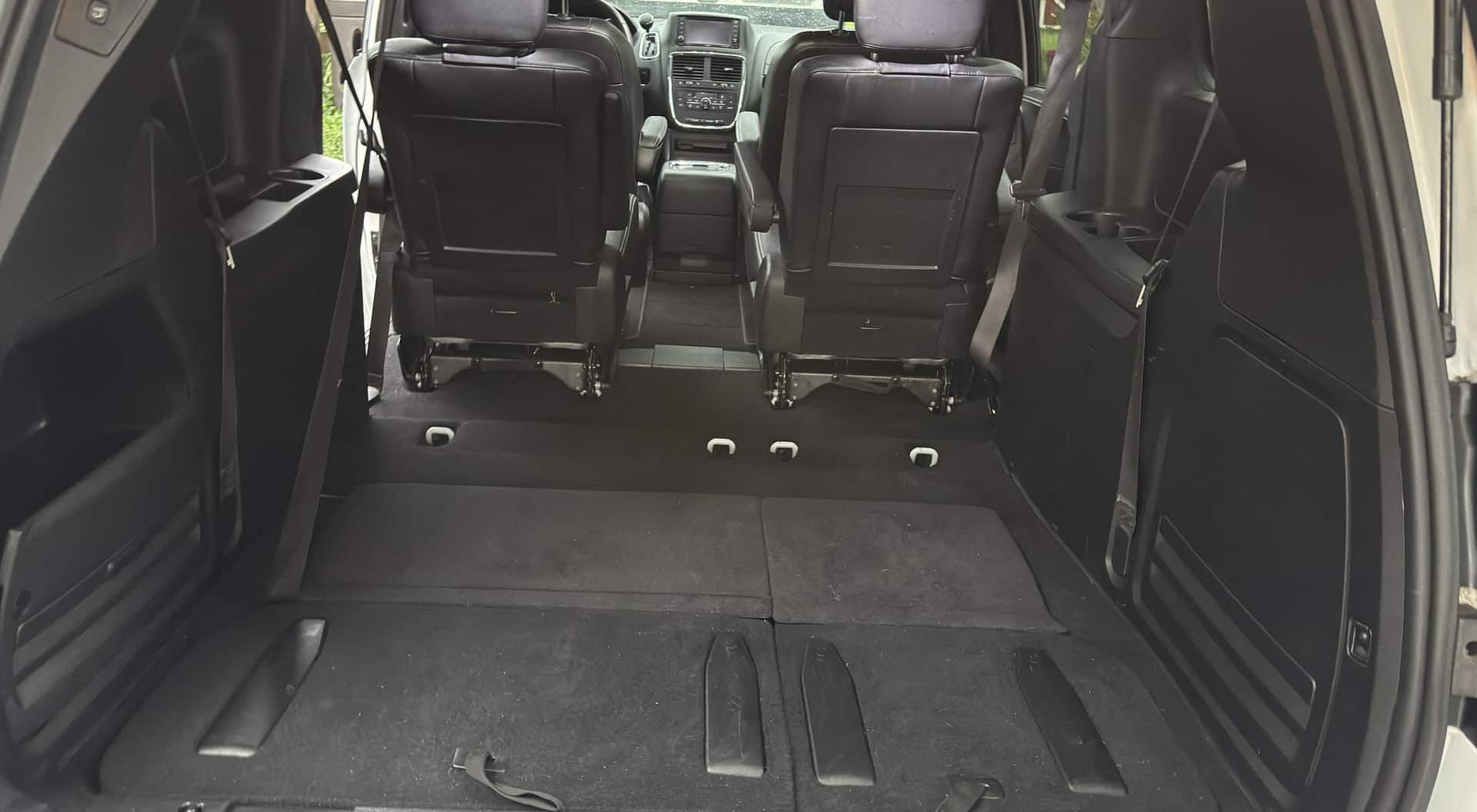 Minivan cargo floor vacuumed with the third row folded down