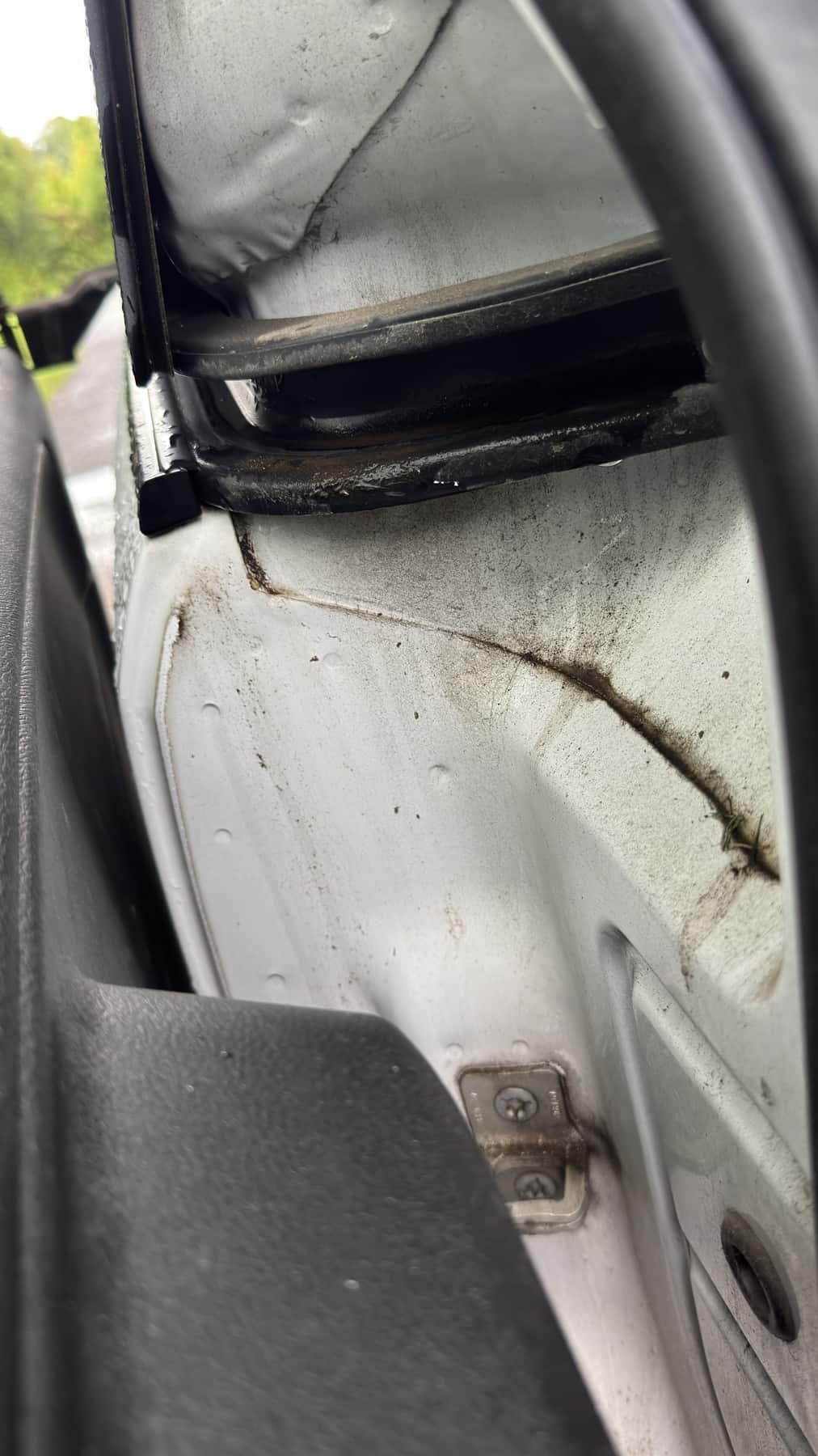 Minivan door jamb with dirt and grime before cleaning