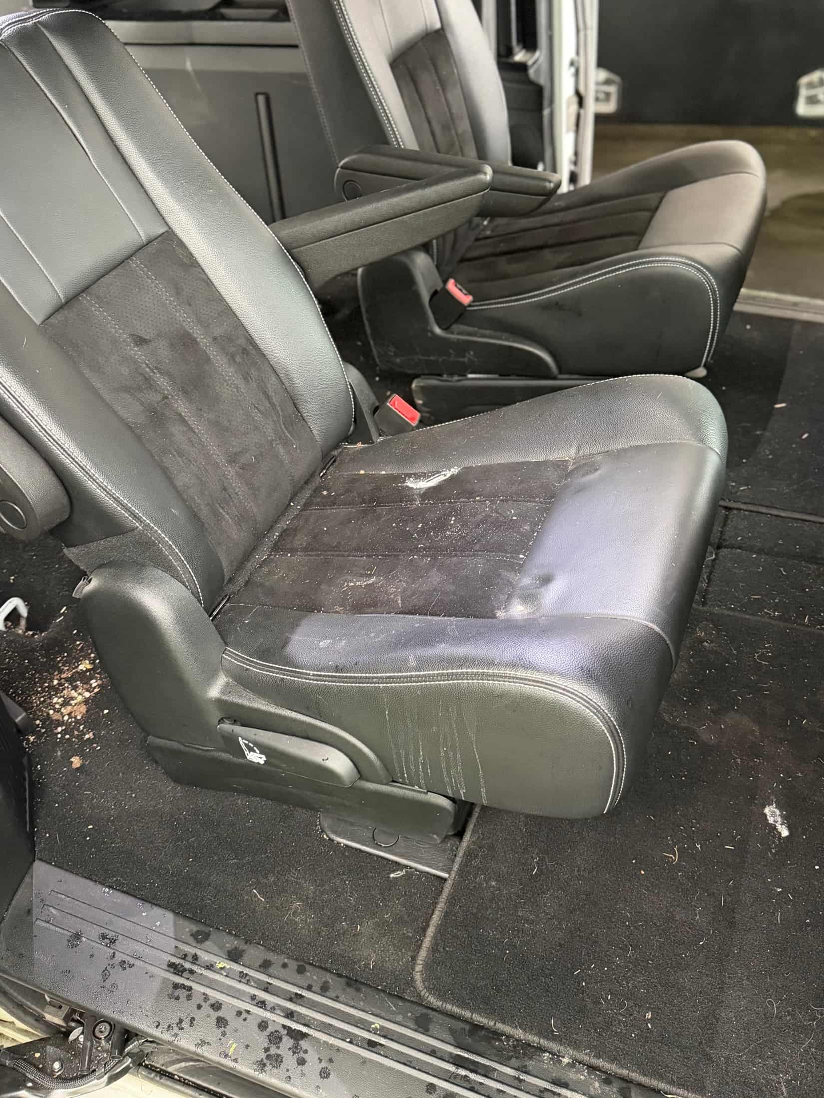 Dirty minivan seats before an interior detail