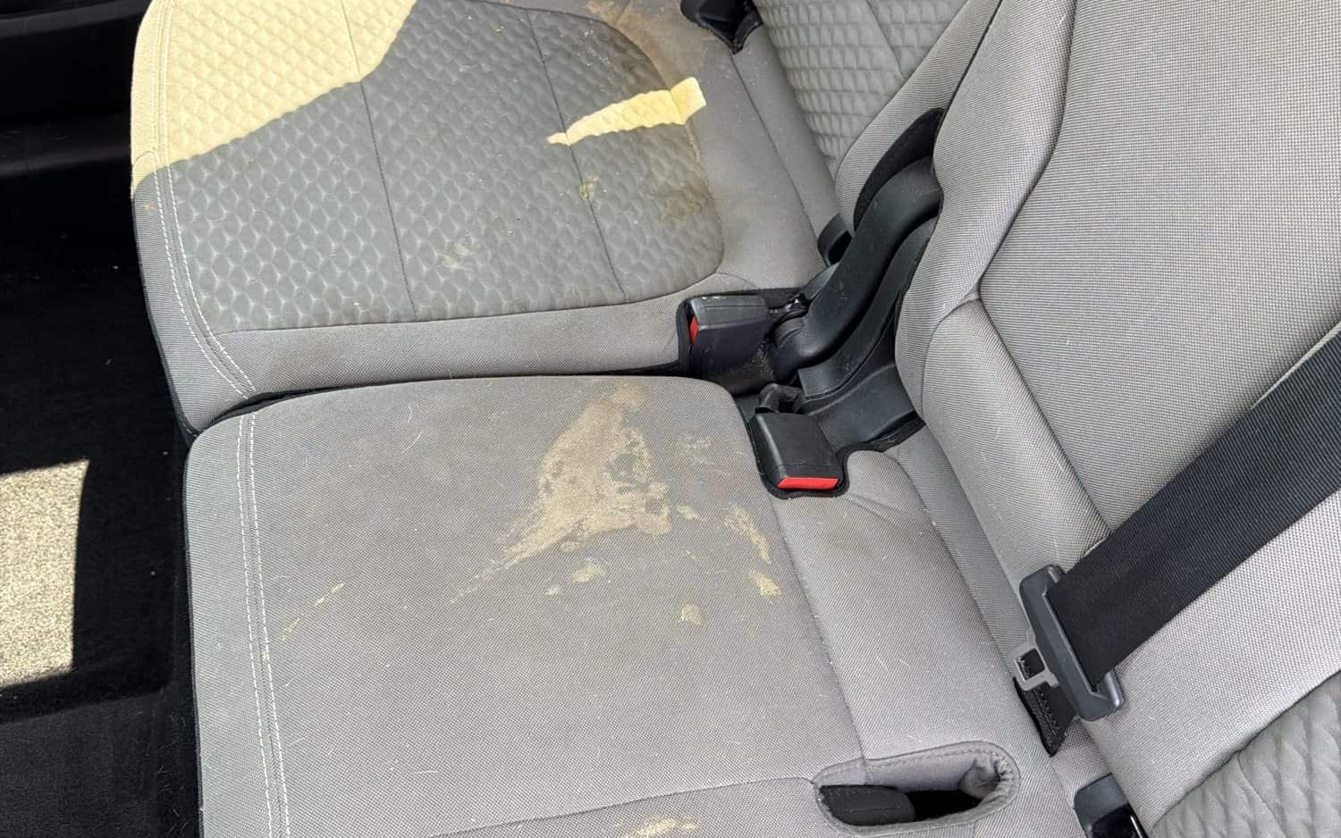 Stained cloth rear seat before shampooing