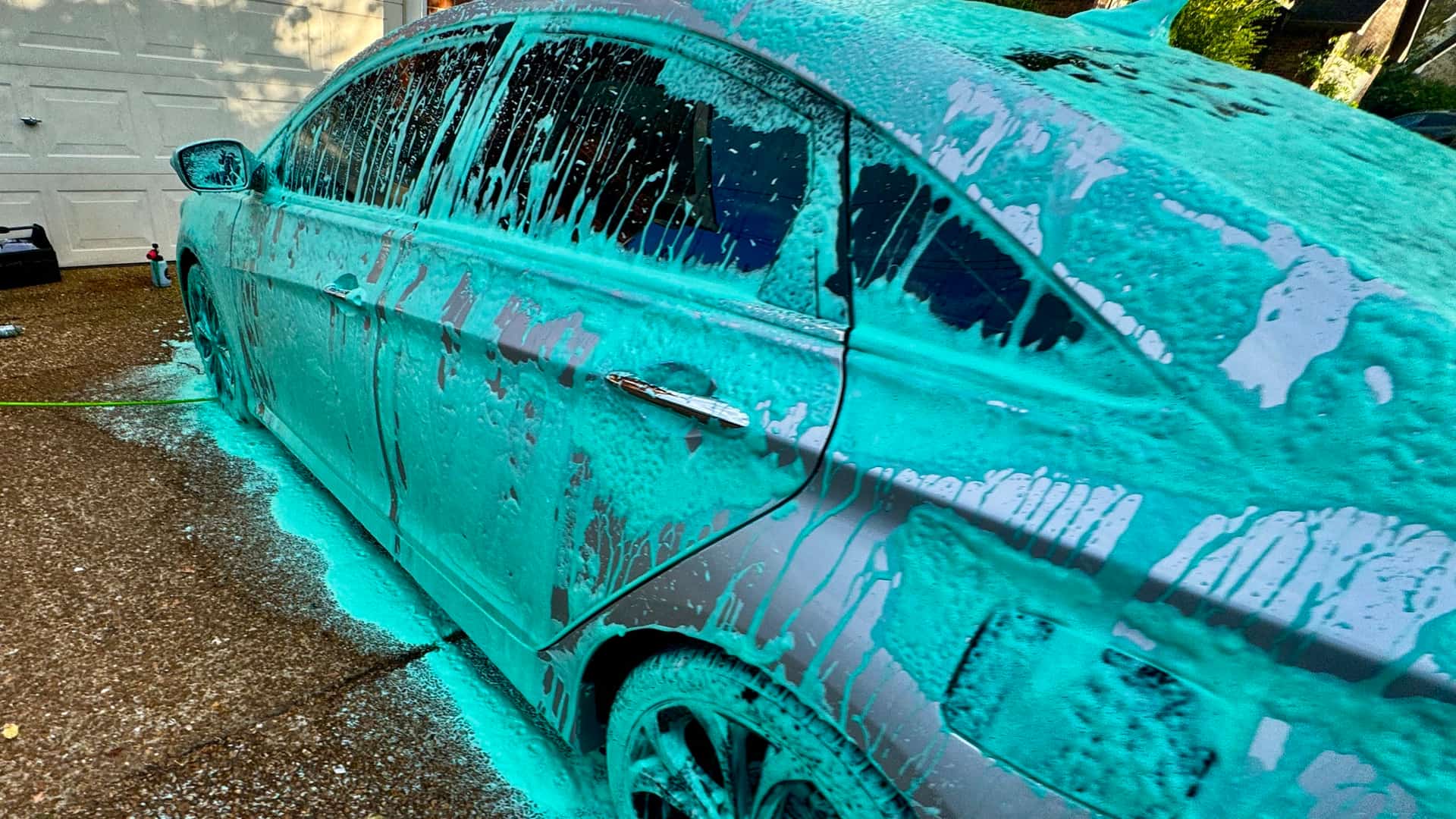 Side of a Hyundai Sonata covered in teal foam