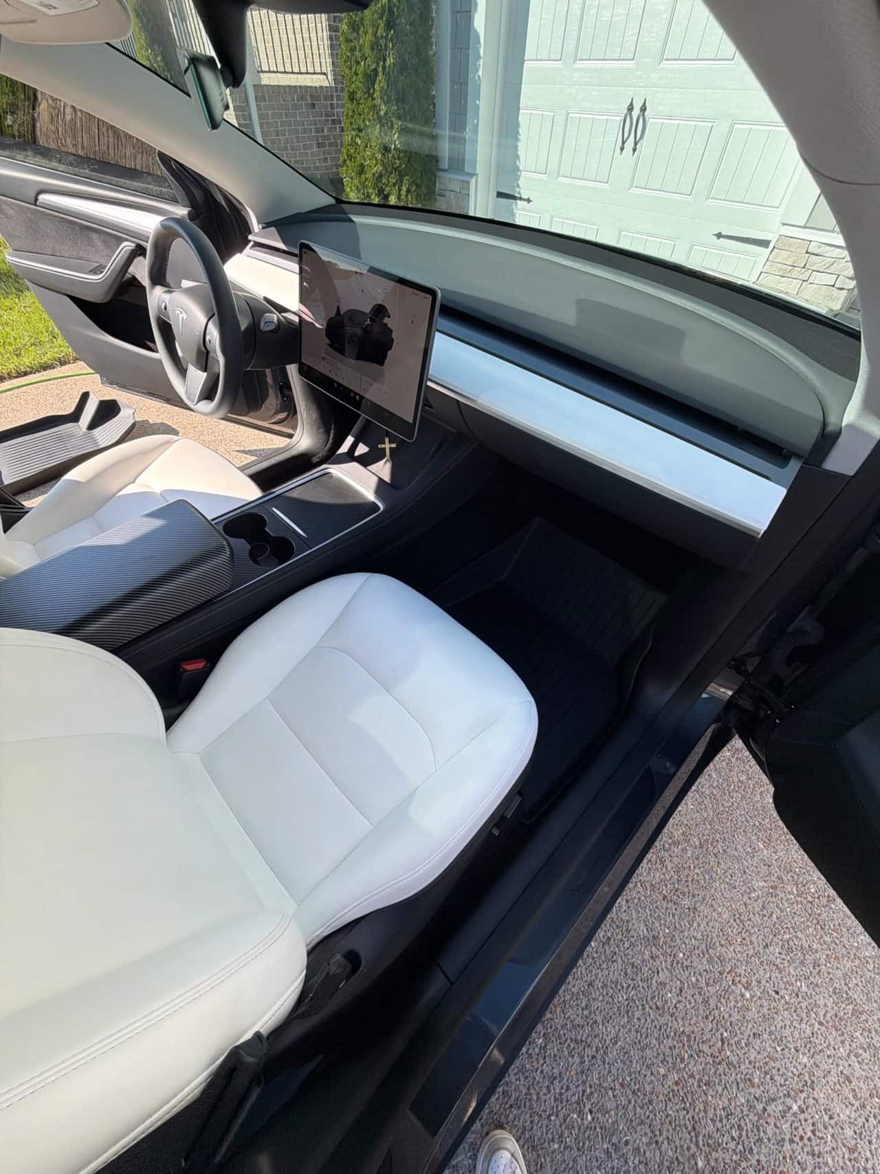 Tesla white front seats after an interior detail